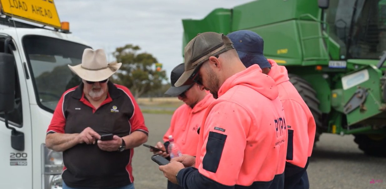 Farm crew checking in on their phones